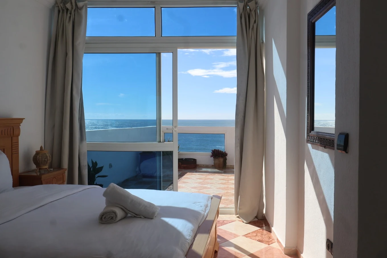 A private double room with an ensuite bathroom and a balcony.