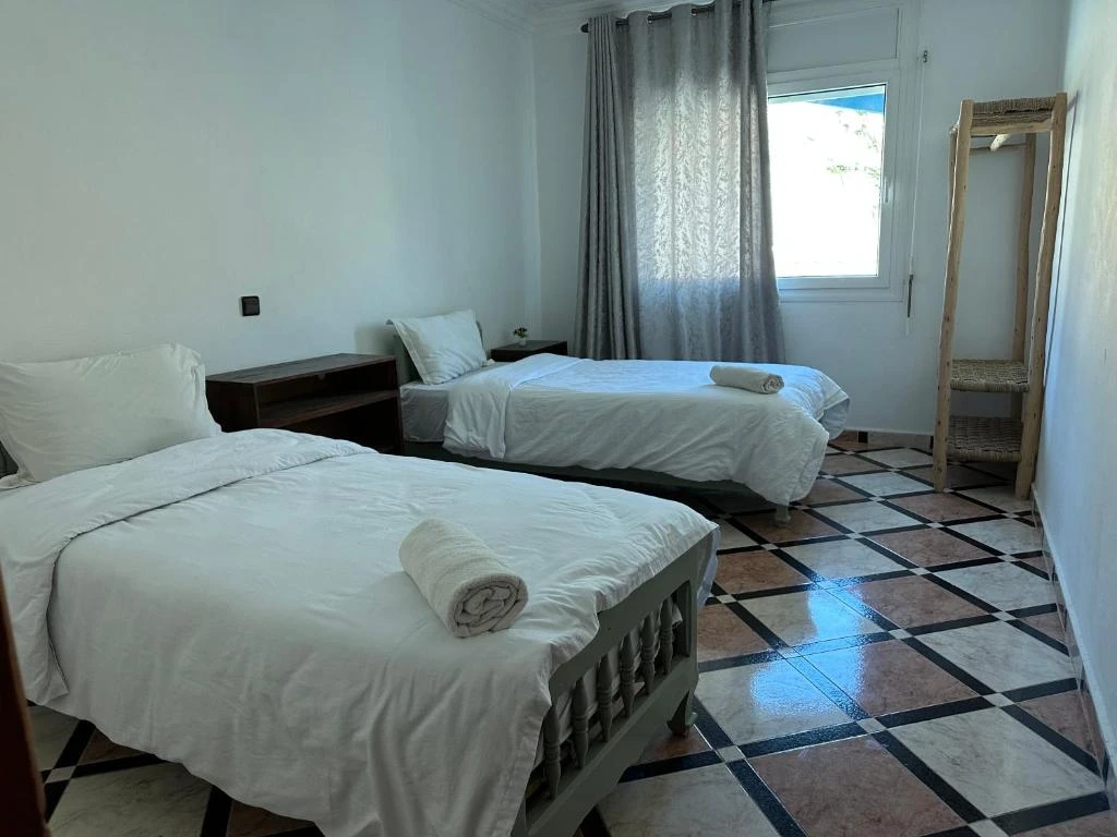 A cozy private double room with a comfortable bed.
