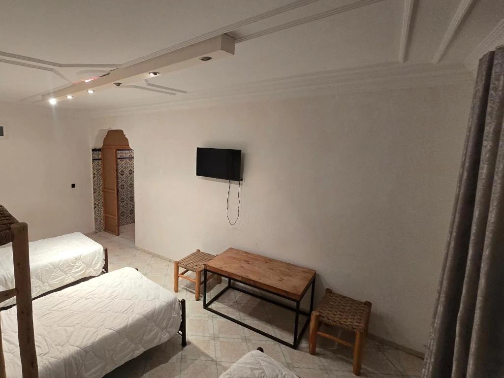 A cozy studio apartment with a combined living and sleeping area.