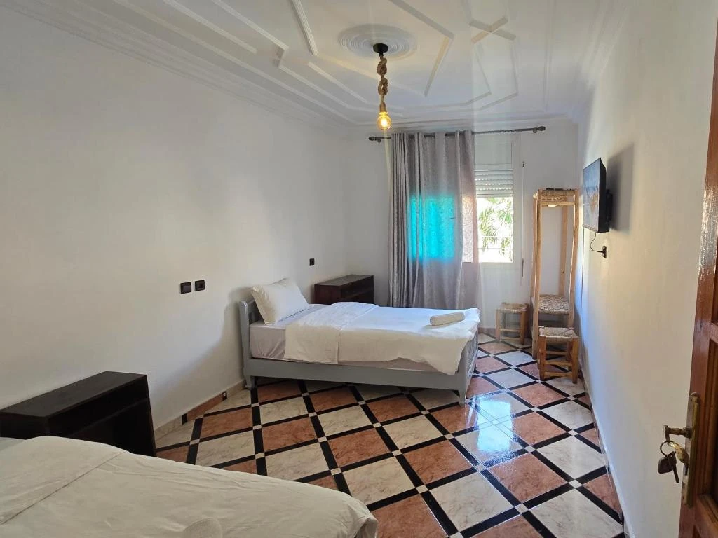 Twin room with shared bathroom
